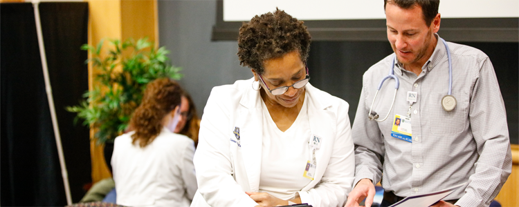 Two clinicians in discussion