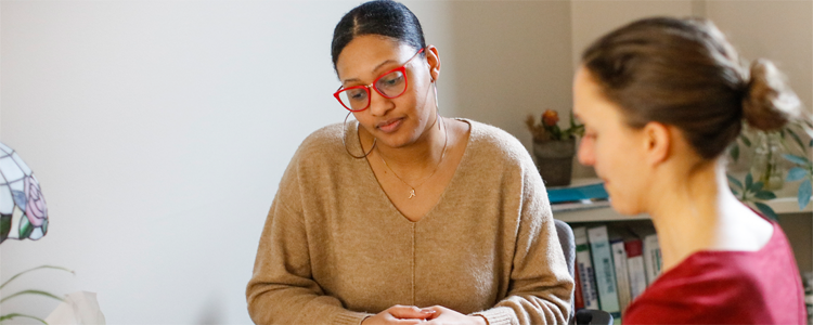 Employee talking with clinician